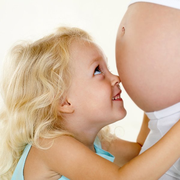 Child Holding her Mommy’s Tummy 1 Child Holding her Mommy's Tummy 1